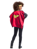 Back view of a girl wearing the red Wonder Woman cape with gold logo and headpiece