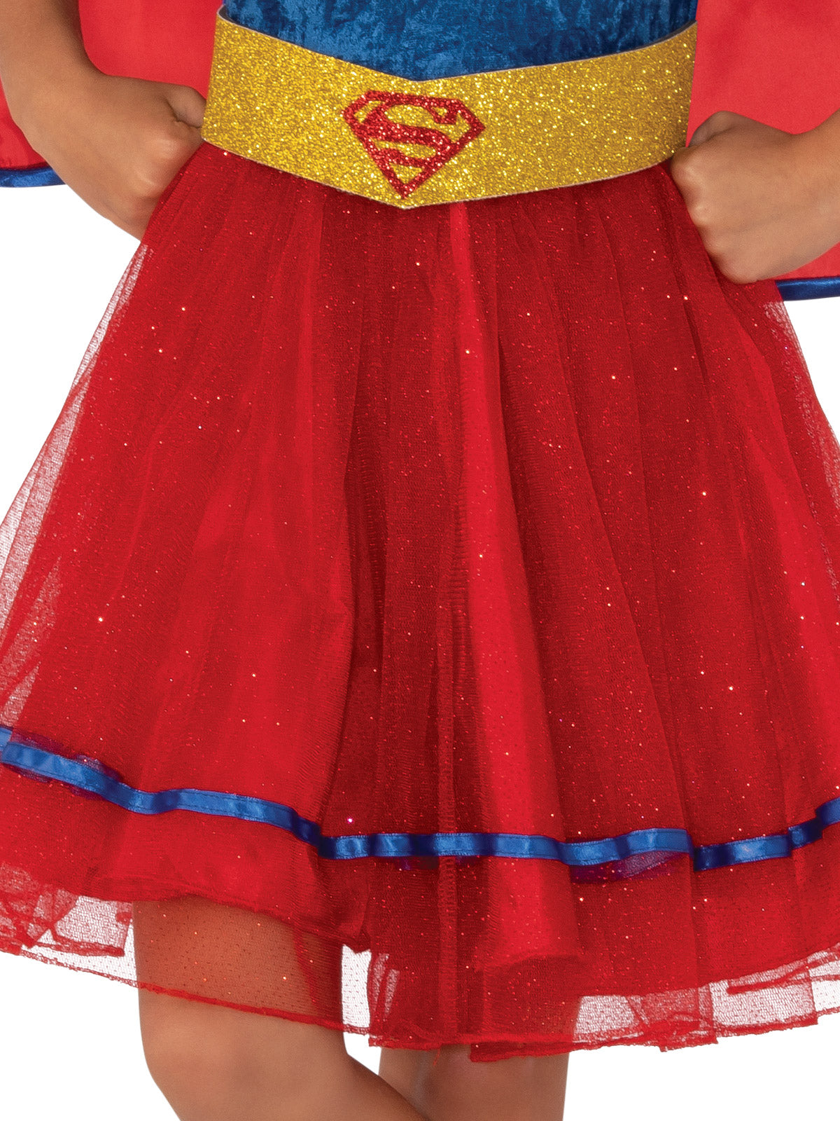Close-up of the Supergirl tutu dress's gold glitter belt with emblem and red tulle skirt with blue trim