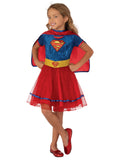 Girl wearing a Supergirl tutu dress with S emblem bodice, gold glitter belt, red tulle skirt and cape