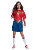 Teen girl in the Wonder Woman 1984 oversized tee costume with printed eagle and skirt, tiara and gauntlets