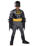 Boy in premium Batman muscle jumpsuit with yellow bat emblem and belt, gauntlets, cape and half mask