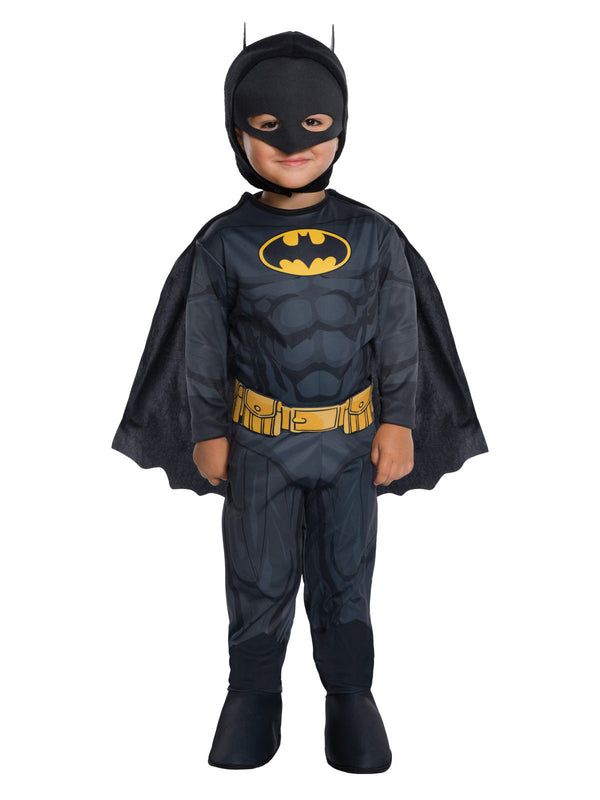 Toddler in a Batman jumpsuit with padded muscle chest, yellow belt, boot tops, scalloped cape and eared mask