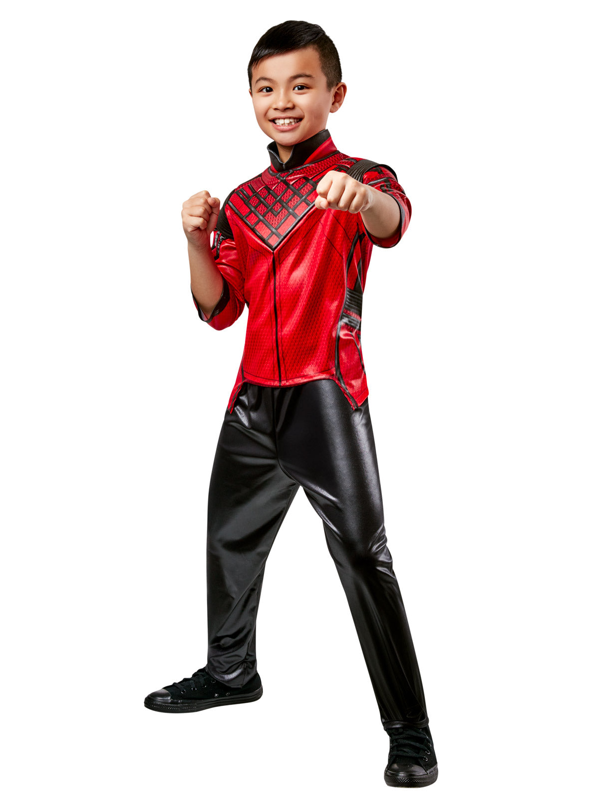 Boy wearing a Shang-Chi costume with red padded wet-look top with shoulder pieces and black pants