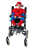 Boy using a wheelchair, wearing an adaptive Spider-Man costume with padded top, printed pants and mask
