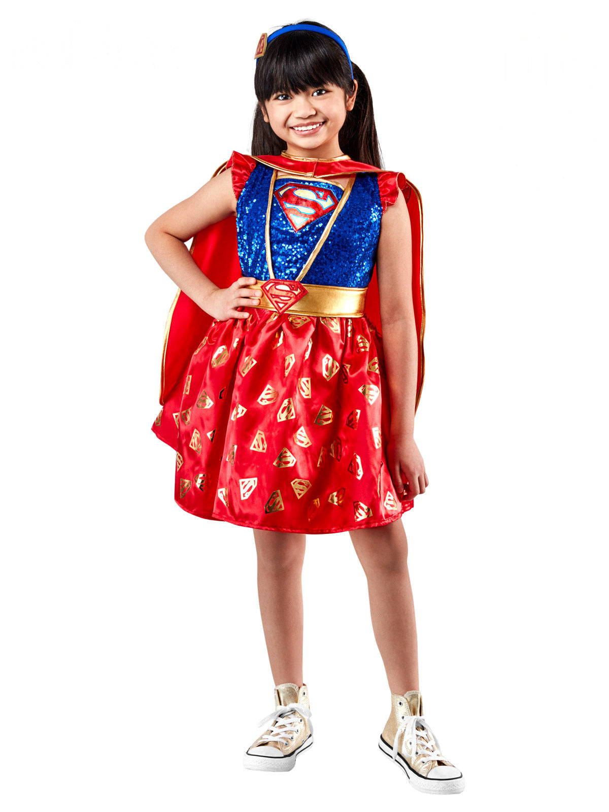 Girl in the Supergirl premium costume with a blue sequin bodice, red emblem tutu skirt and short cape