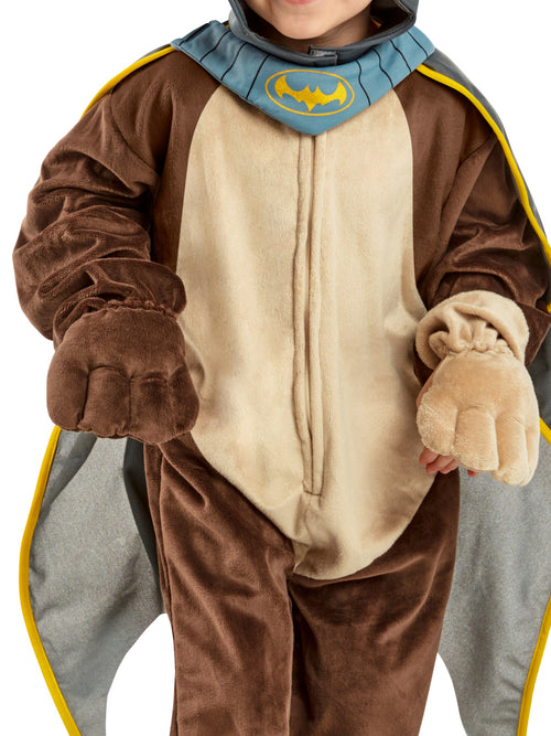 Close-up of the Ace costume's brown and tan jumpsuit, paw hand covers and blue collar with Bat logo