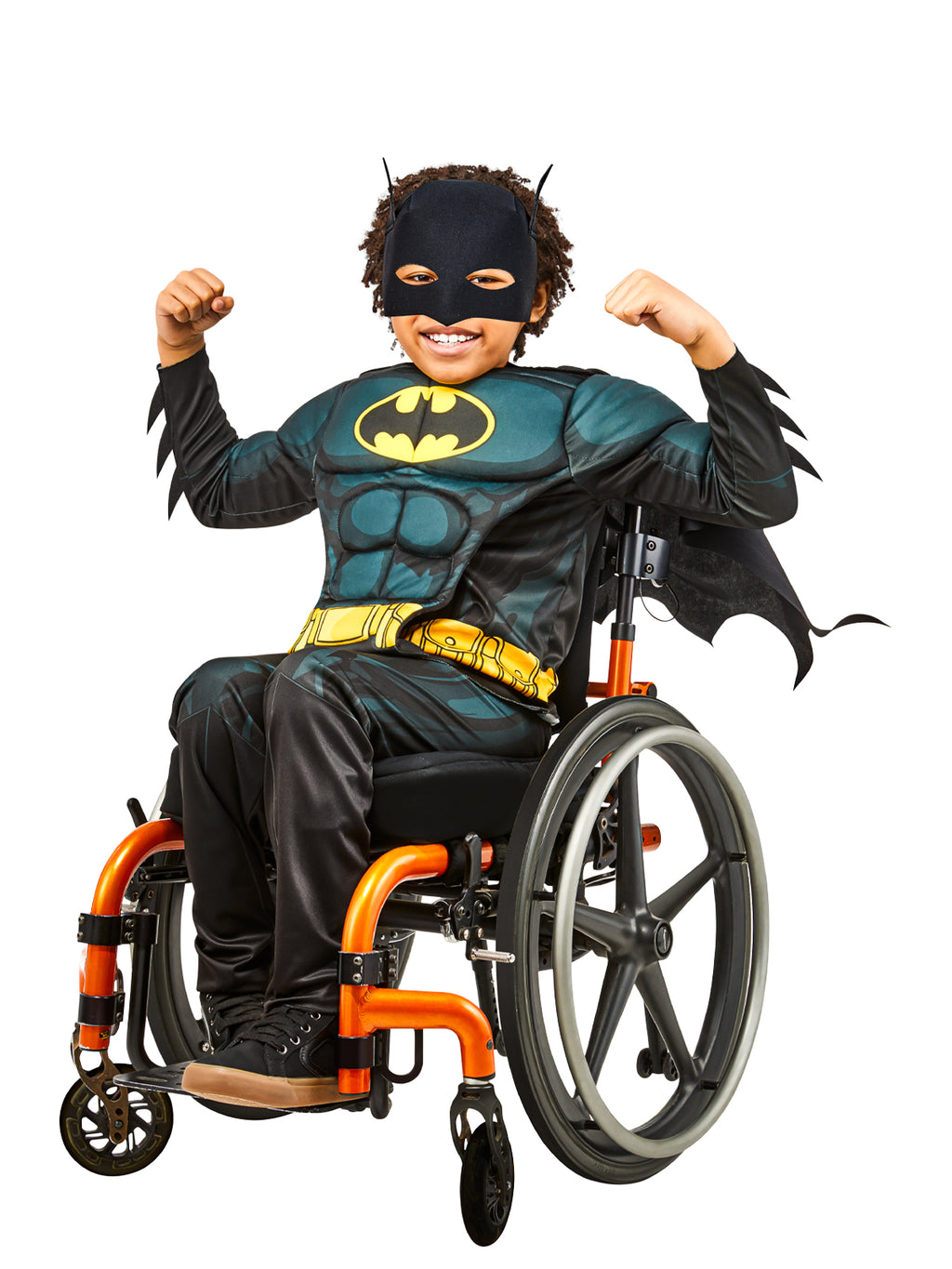Boy using a wheelchair in the Batman adaptive costume with muscle top, bat ears headpiece and cape
