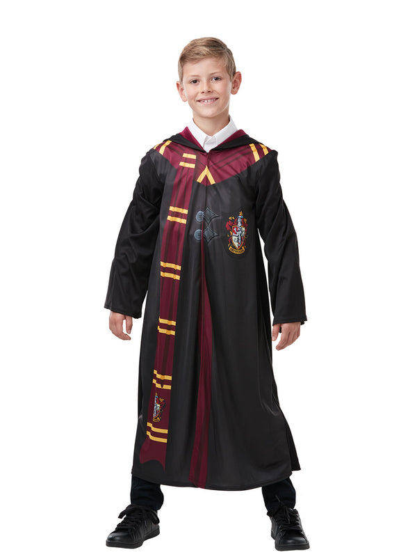 Boy in the Harry Potter Gryffindor robe with a burgundy and gold striped scarf and House crest