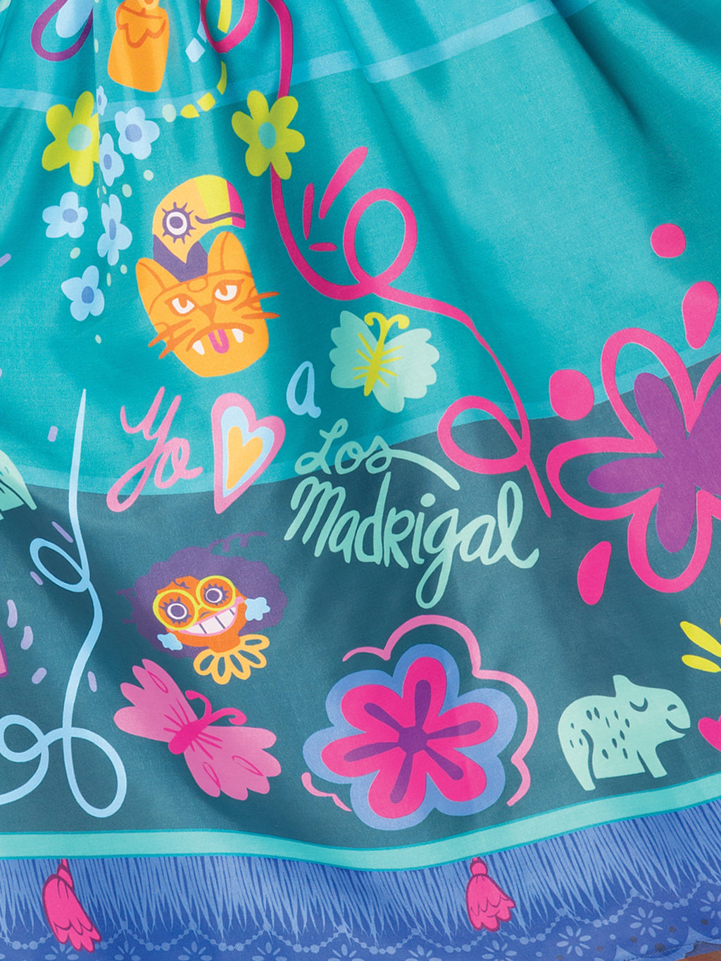 Close-up of the Mirabel skirt print with flowers, butterflies and the Madrigal family symbols