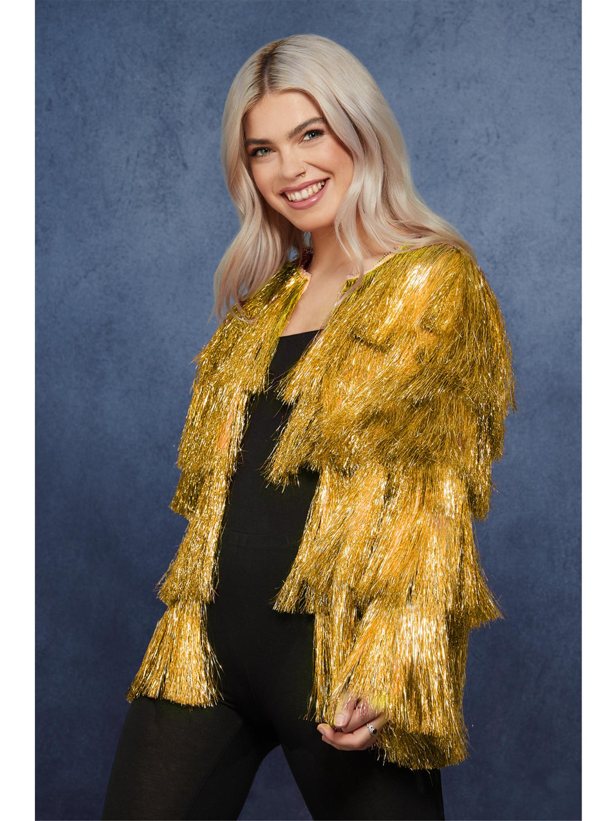 Woman wearing a gold tinsel festival jacket