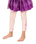 Girl's legs in pale Rapunzel footless tights with a character print