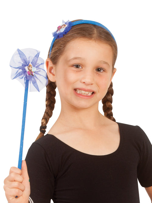 Girl wearing a blue Anna headband and holding a matching star wand