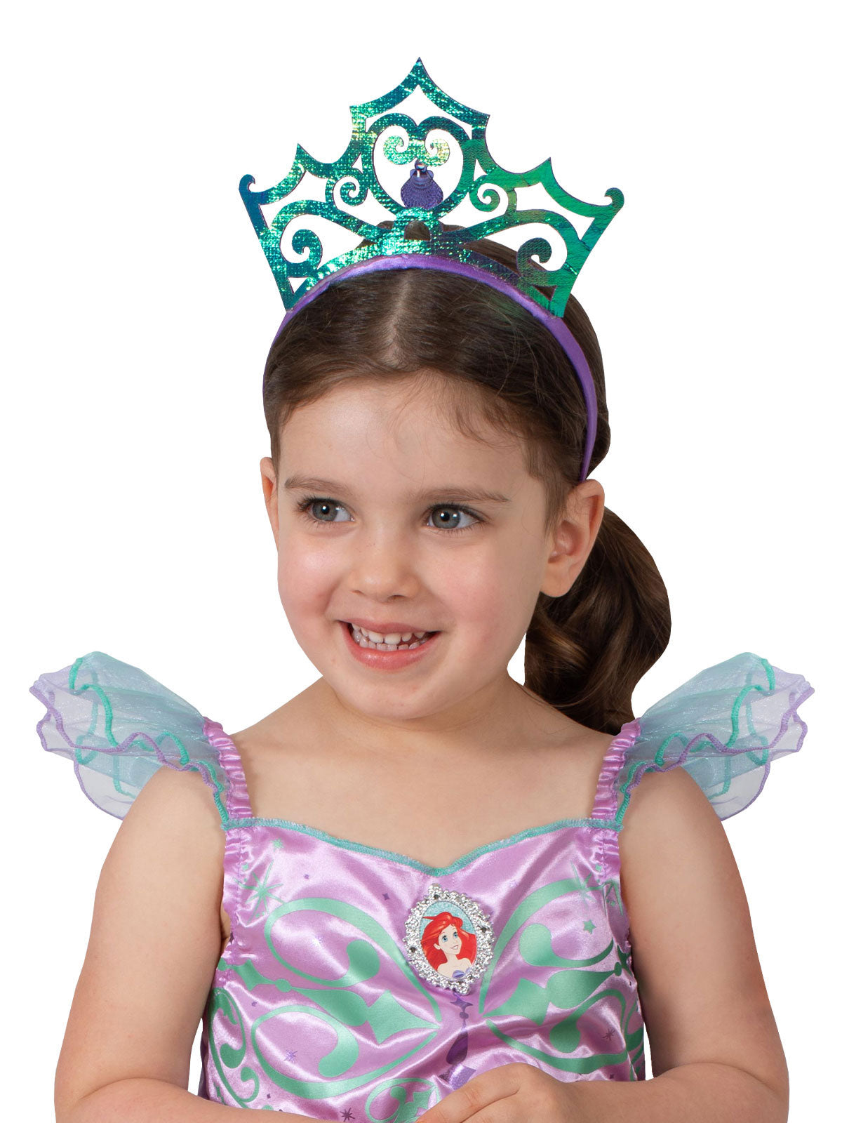 Girl wearing the iridescent green and purple Ariel tiara with a clamshell centre