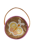 Round goldy-orange Emma Memma bag with a pink and peach butterfly and handle