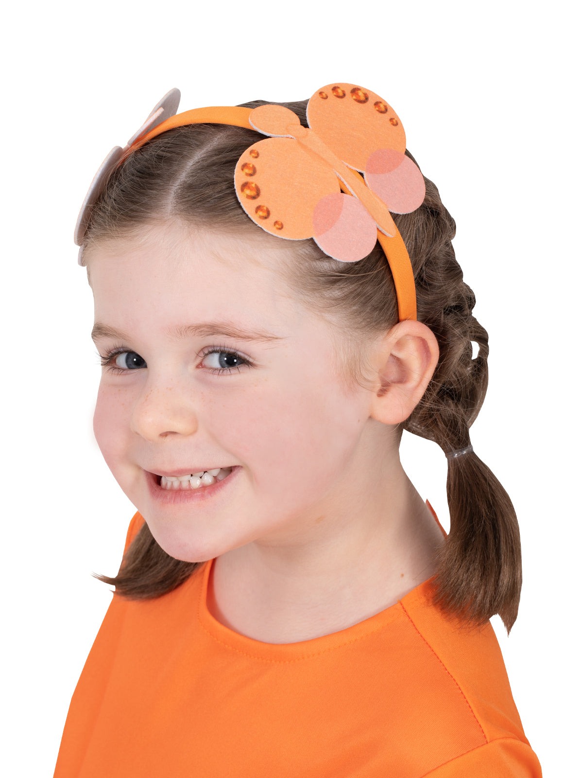 Girl wearing the orange Emma Memma headband with felt butterflies