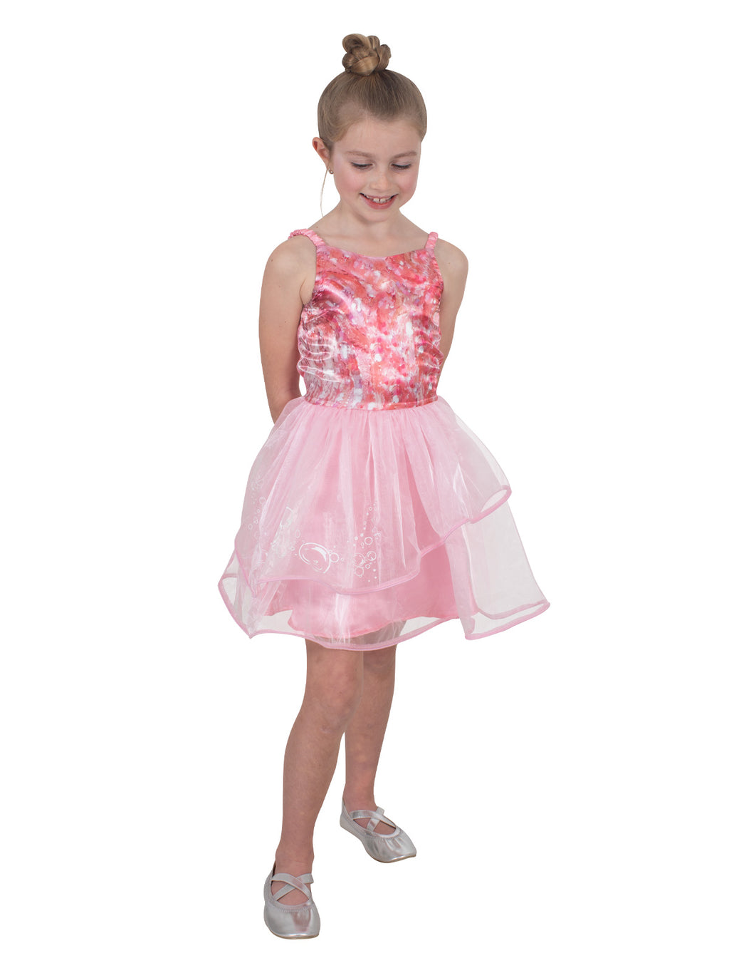 Girl in the pink Glinda tutu dress with shoestring straps and a tulle skirt, side view