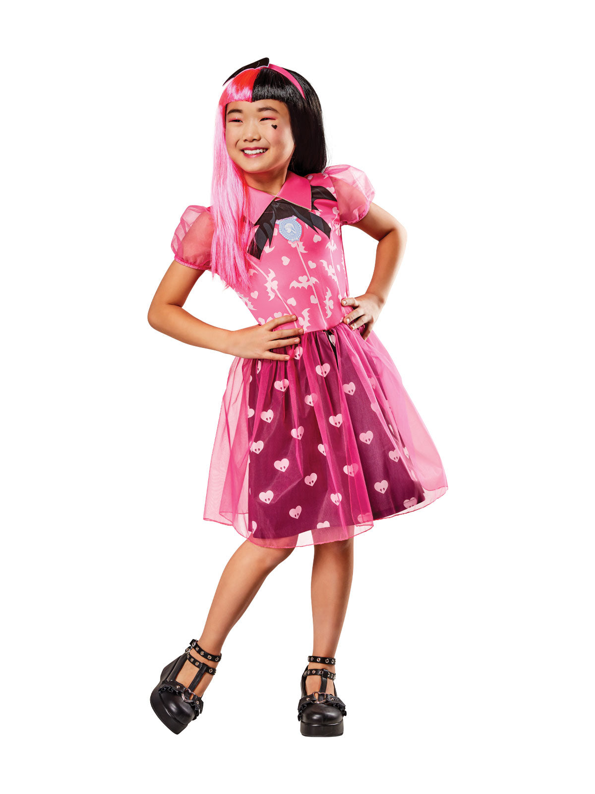 Girl in Monster High Draculaura pink dress with bat print, heart tulle skirt and bat headband