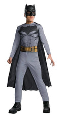 Boy in grey Batman jumpsuit with black bat emblem, printed gold belt, black cape and half mask