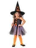 Girl wearing a purple and black tulle witch tutu dress with orange criss-cross ribbon bodice and matching witch hat