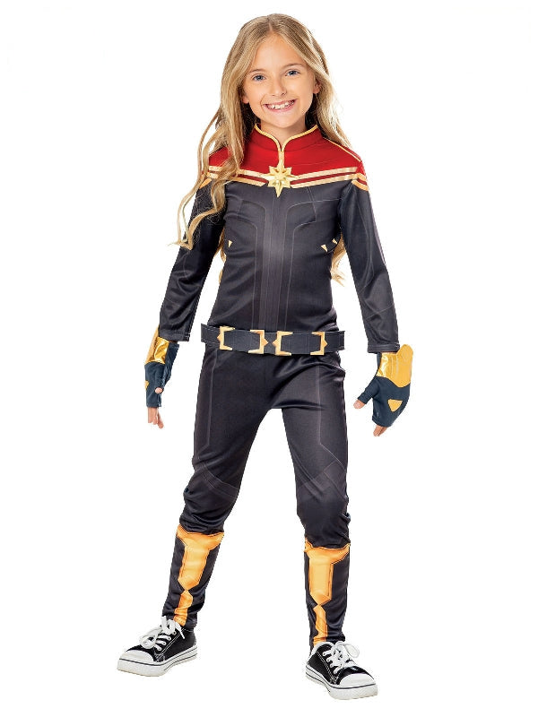 Girl in The Marvels Captain Marvel jumpsuit in navy with red and gold star, belt and gauntlets
