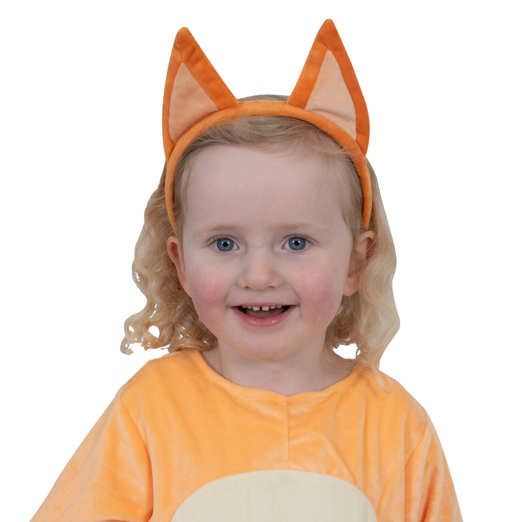 Young child wearing the orange Bingo plush ears headband, front view