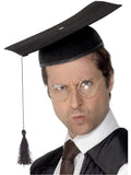 Man wearing a black graduation mortarboard hat with tassel