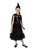 Girl in the Wicked For Good Elphaba dress with a frilly black skirt, mini cape and witch hat