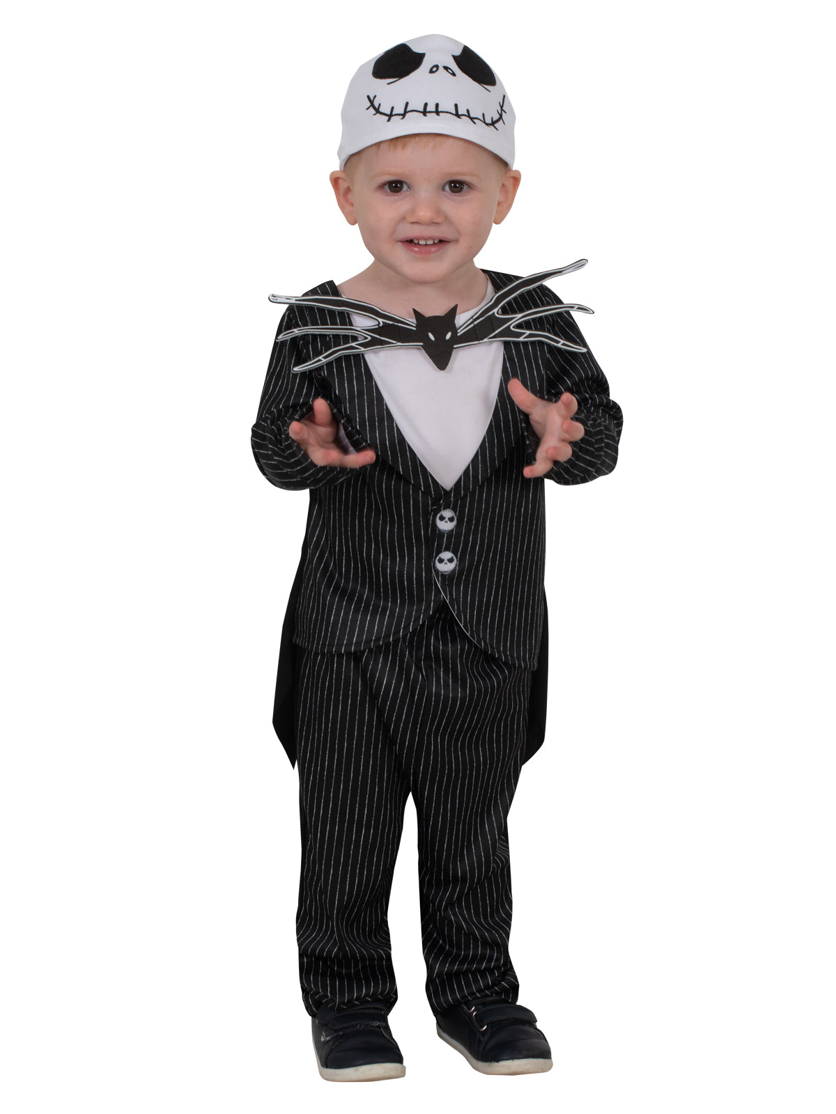 Toddler standing in the Jack Skellington pin-striped suit and white skeleton-face beanie