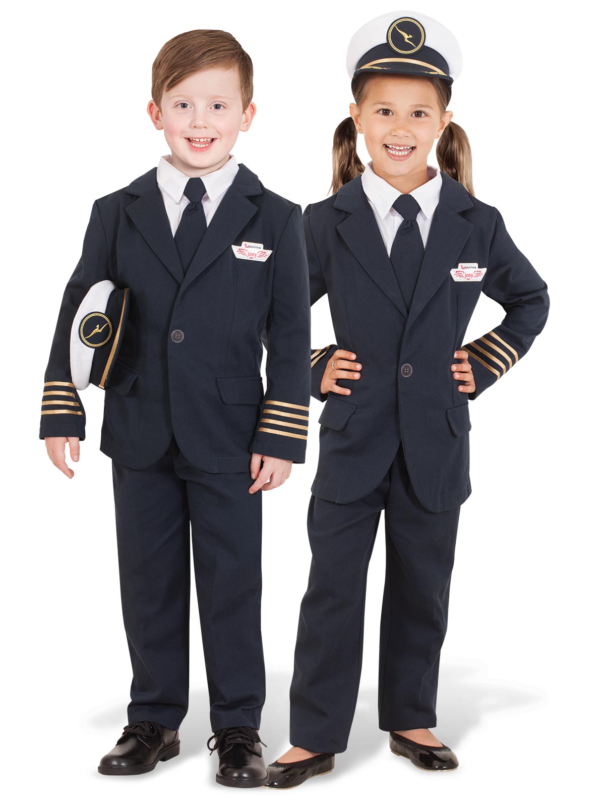 Boy and girl in navy Qantas captain's uniforms with gold-striped cuffs, ties and captain's hat