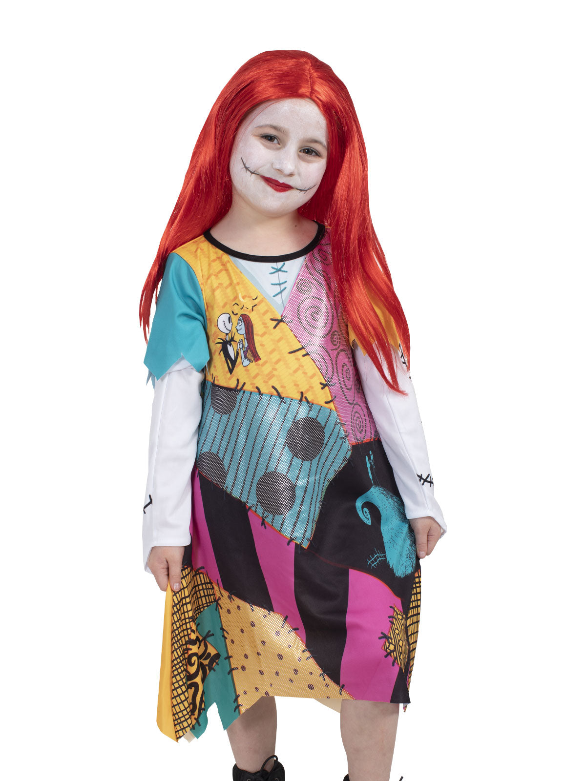 Close-up of the Sally dress's colourful patchwork print, stitched sleeves and red wig