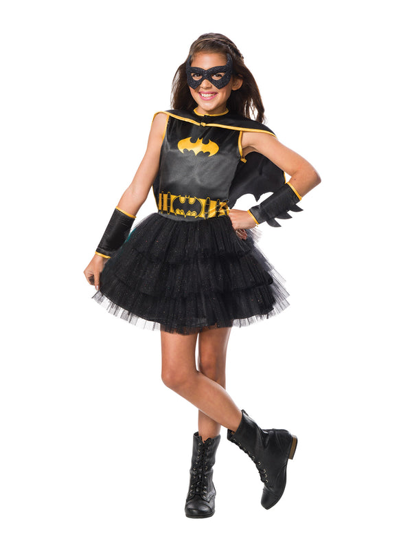 Girl in Batgirl tutu dress with black tulle skirt, yellow bat emblem and belt, glitter mask and cape