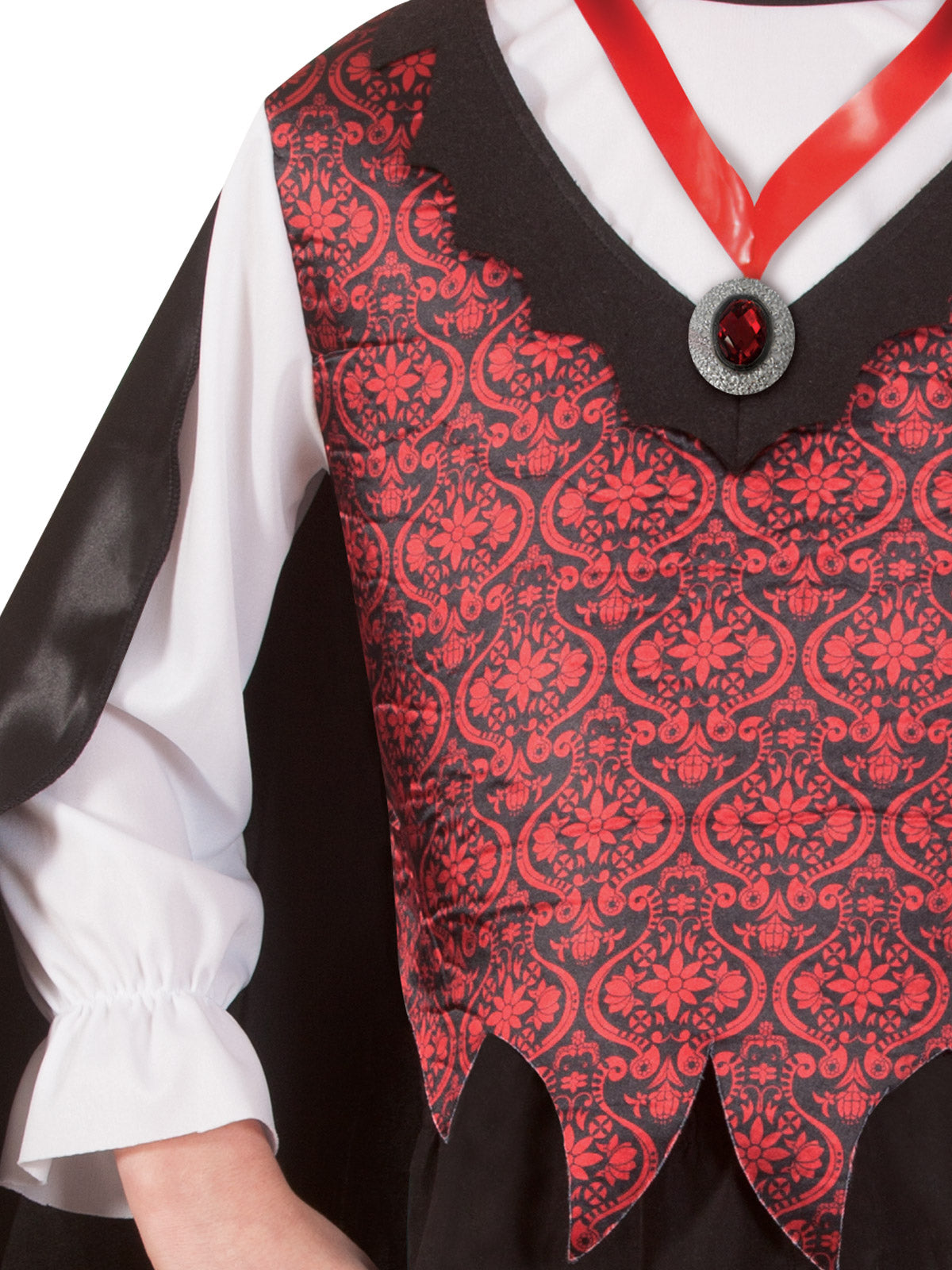Close-up of the vampire costume's red damask print vest, medallion on red ribbon and flounced cuff