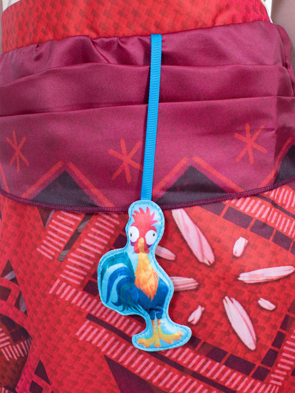 Close-up of the foam Heihei chicken accessory attached to the Moana Deluxe skirt