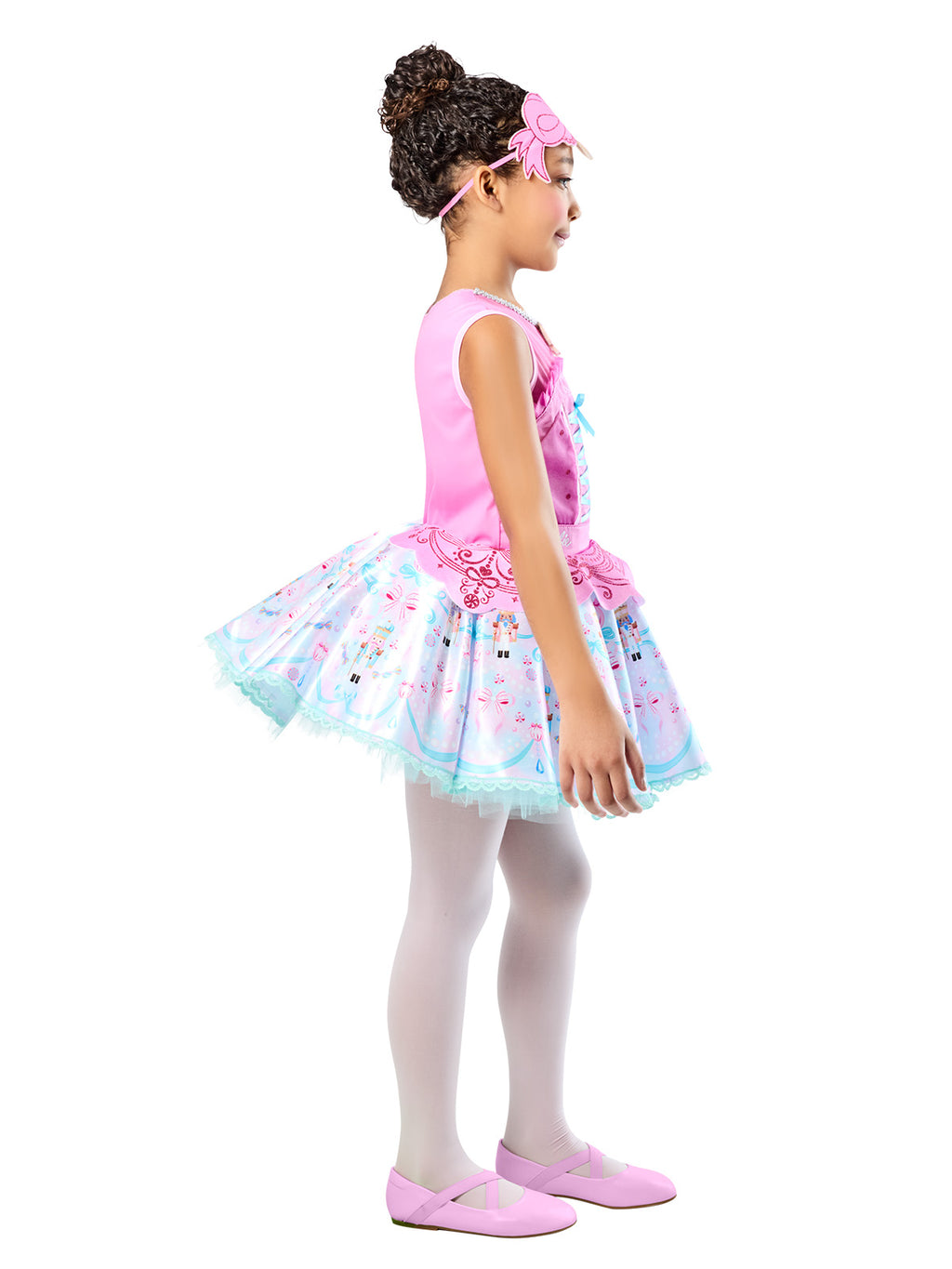 Side view of the Barbie Nutcracker dress's full layered tutu with printed motifs