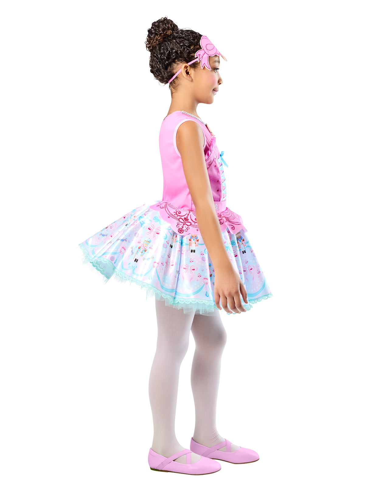 Side view of the Barbie Nutcracker dress's full layered tutu with printed motifs