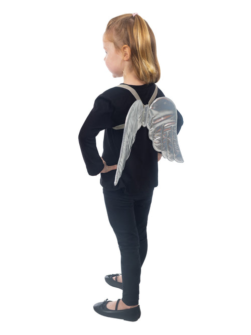 Silver angel wings with printed stars worn by a girl, side view