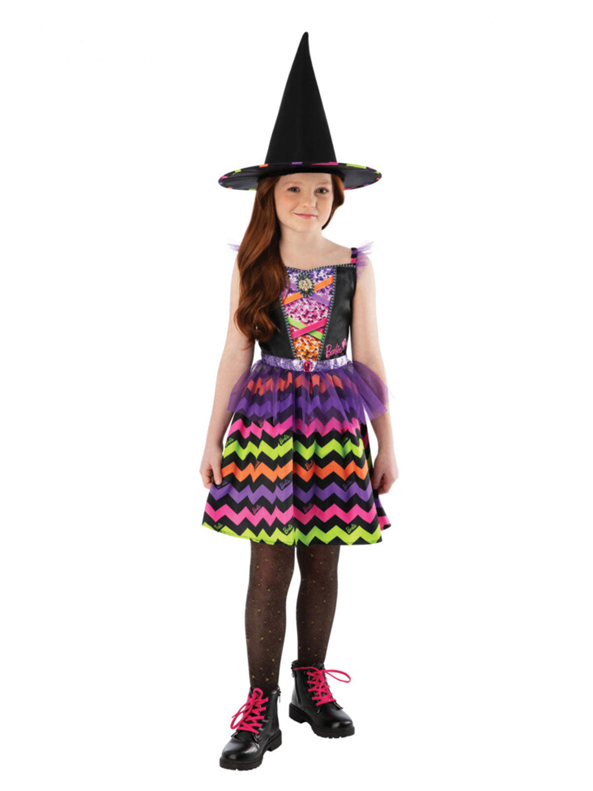 Girl wearing a Barbie witch dress with black velour top, rainbow zigzag satin skirt and tall black witch hat