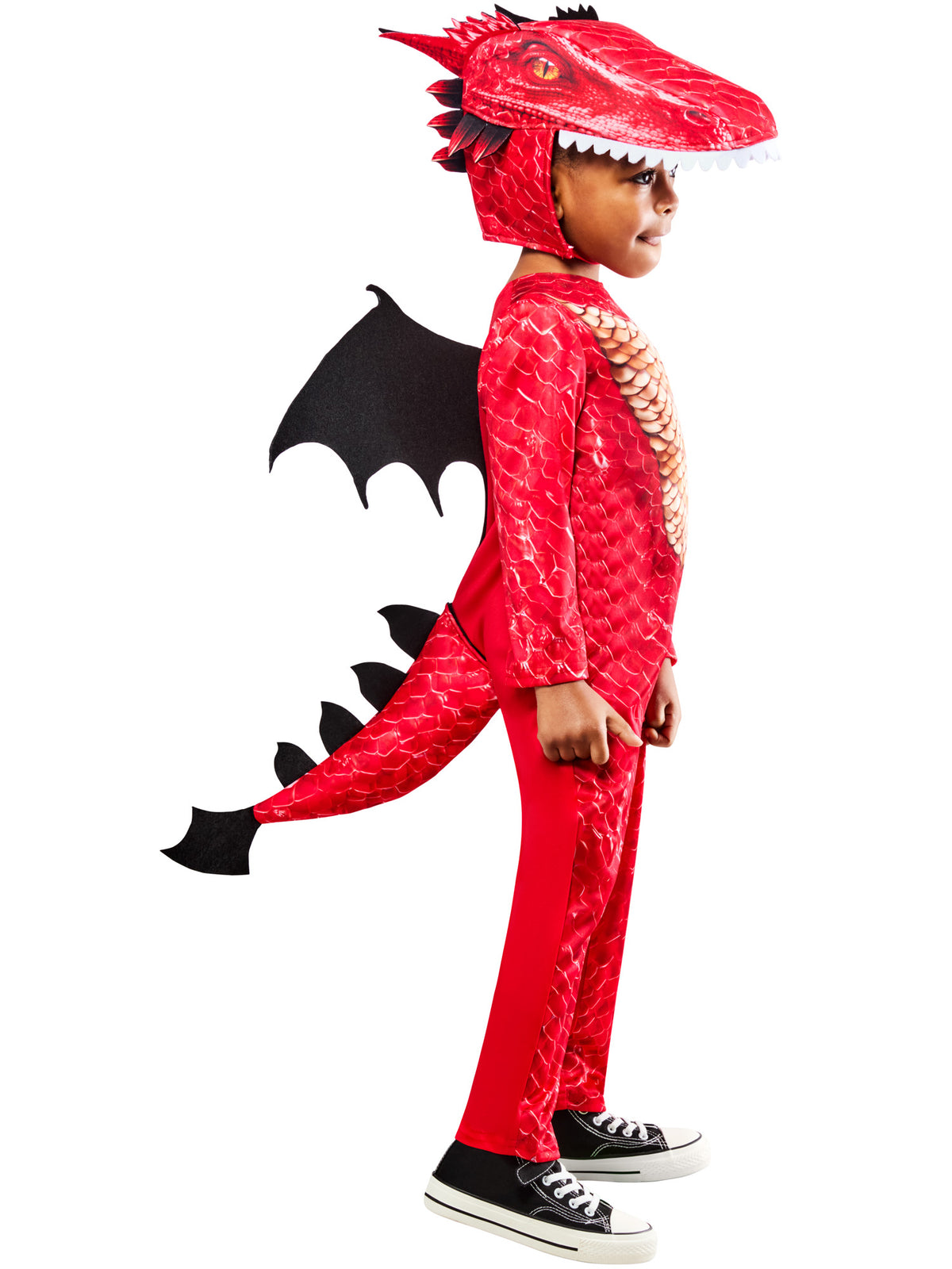 Child in the red dragon costume with spiked tail and black wings, side angle