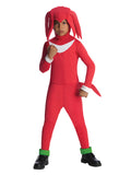 Boy in the Sonic the Hedgehog Knuckles red jumpsuit with white chest print, green cuffs and spiky headpiece