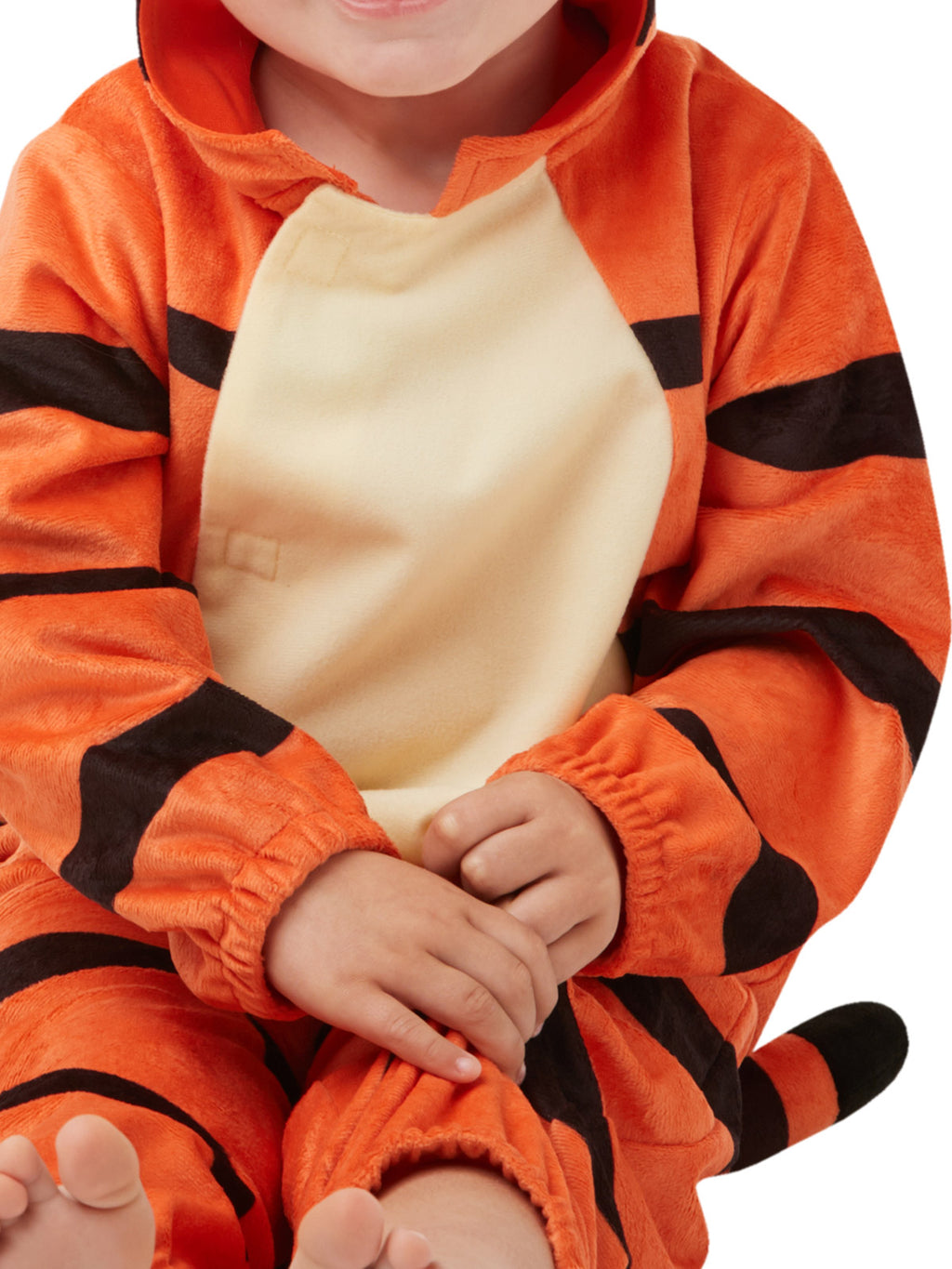 Toddler sitting in the Tigger costume showing the cream tummy panel and orange stripes