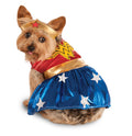 Yorkshire terrier in the Wonder Woman pet costume, red top with gold emblem, blue star skirt and tiara