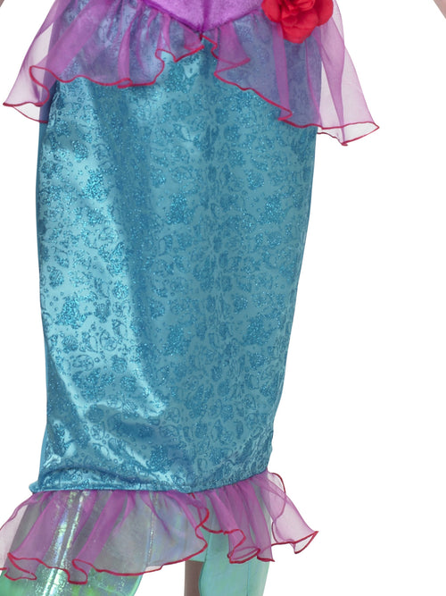 Close-up of the Ariel shimmer dress's teal glitter pencil skirt with lilac tulle peplum and fin