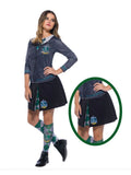 Woman wearing the Slytherin skirt with green and silver inset panels, teen and adult size