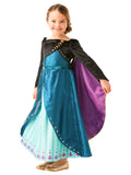 Girl wearing a Queen Anna Frozen 2 dress with black bolero jacket, teal skirt and purple cape