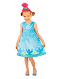 Girl wearing a blue Trolls Poppy dress with printed flowers and headband with upright pink plush hair