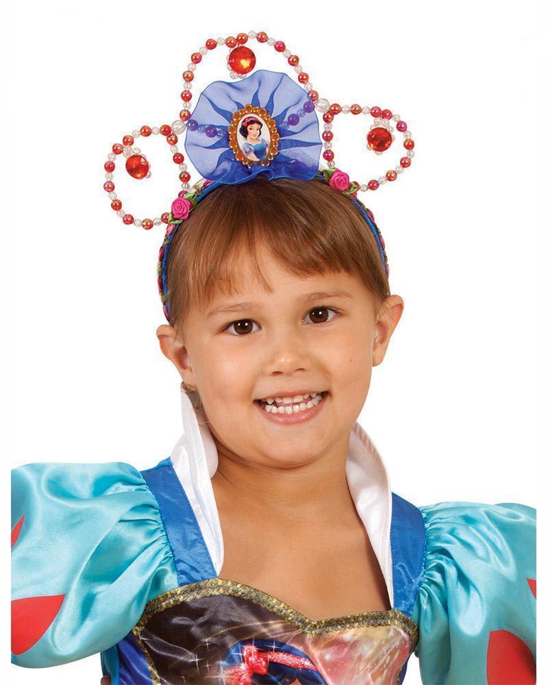 Girl wearing the red and blue beaded Snow White tiara with a character pendant