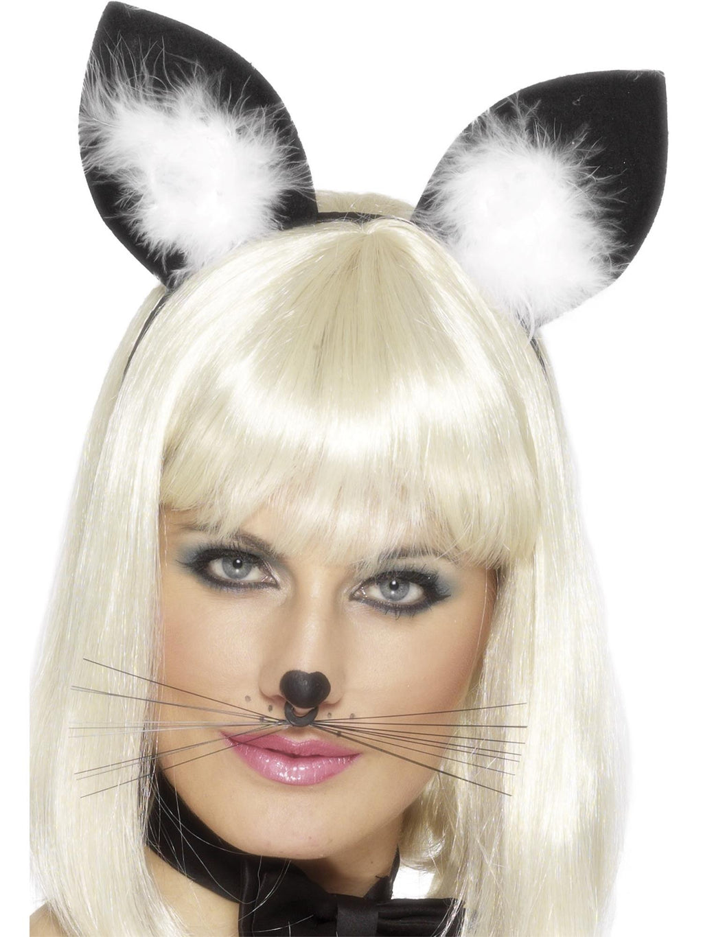 Woman wearing black cat ears with white fluffy centres on a headband