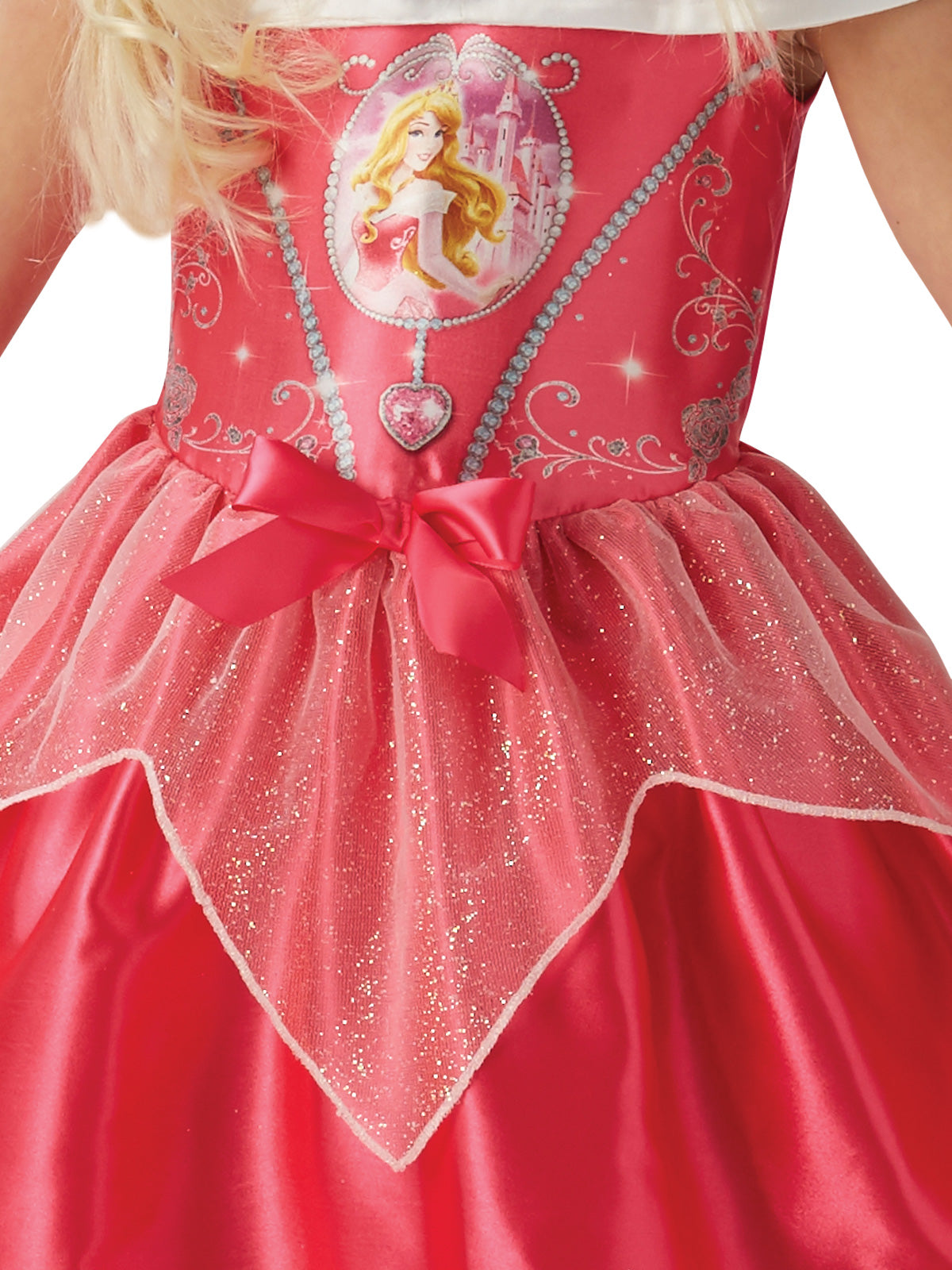 Close-up of the Aurora Fairytale dress's printed character bodice, pink bow and glitter organza peplum