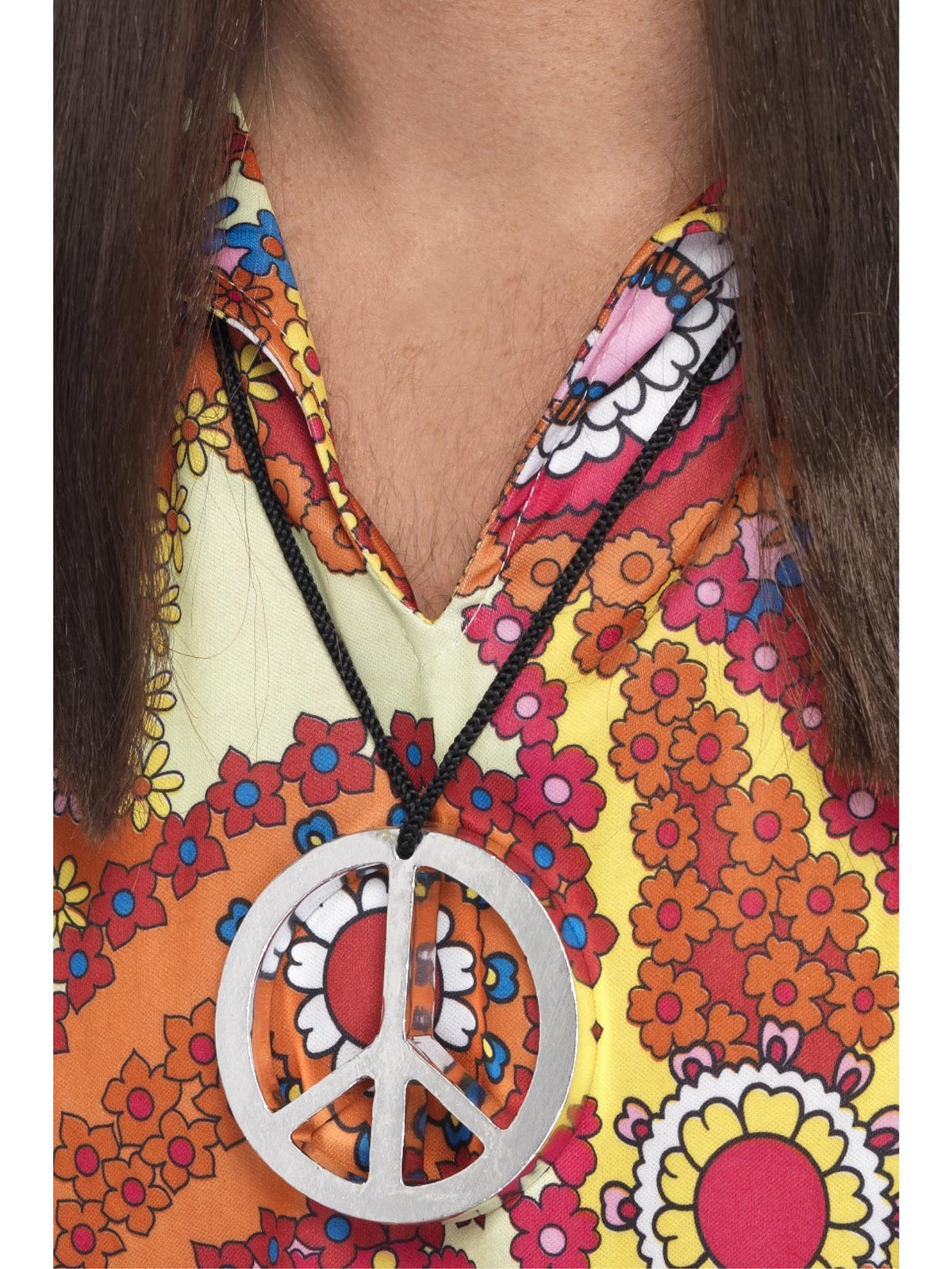 Silver peace sign medallion on a black cord worn over a floral top