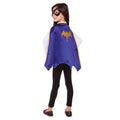 Back view of a girl wearing the blue Batgirl cape with gold bat emblem and black mask